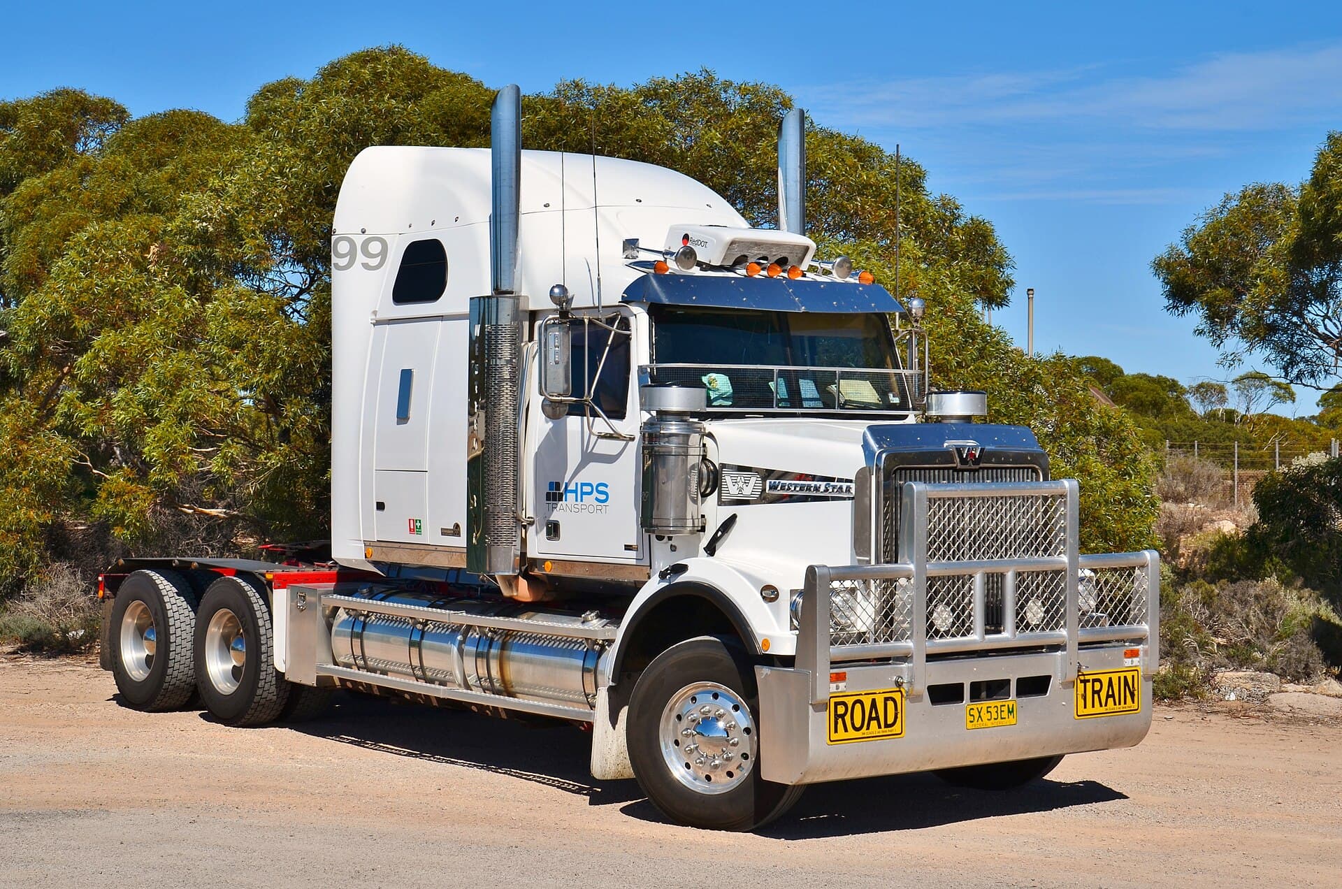 A Western Star 6900 FXC tractor unit, in HPS Transport livery, parked up at the roadhouse at Border Village, South Australia .